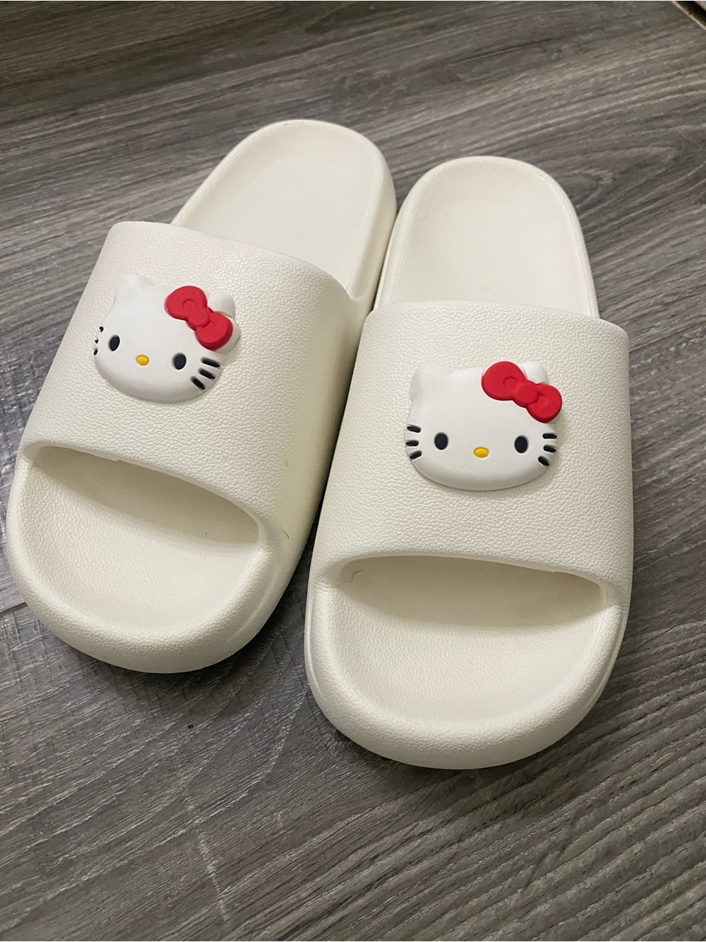 Hello Kitty Cream Slide Sandals with Red Bow Accents